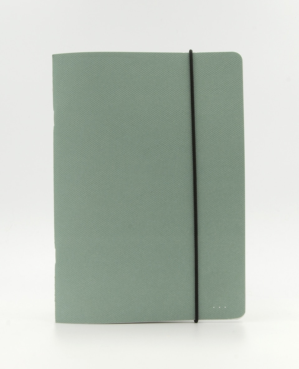 Grünes Notizbuch mit Gummiband
